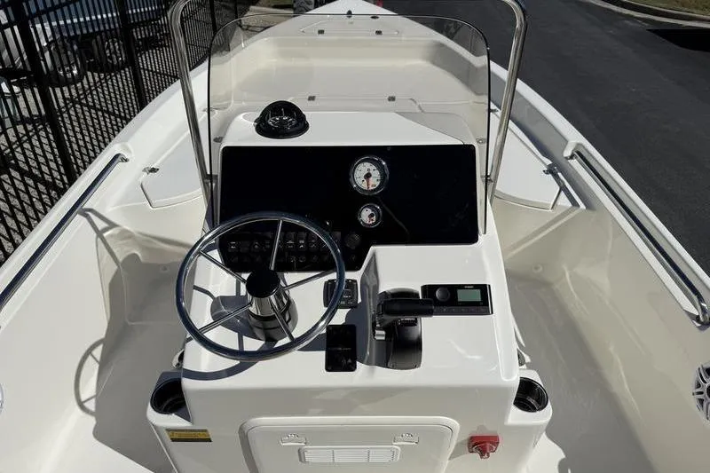 Slide: The Image of 2026 Bulls Bay 2000 boat cockpit with steering wheel and control panel. - 8
