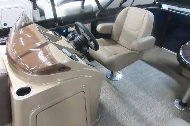 Slide: The Image of 2026 Sylvan 818 Mirage Cruise boat interior with captain's chair and steering console. - 3