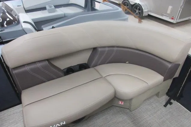 Slide: The Image of 2026 Sylvan 818 Mirage Cruise boat interior with beige and brown seating. - 7