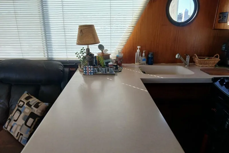 Slide: The Image of Interior of 1977 Hatteras 48 Long Range Cruiser with kitchen counter and decor. - 14