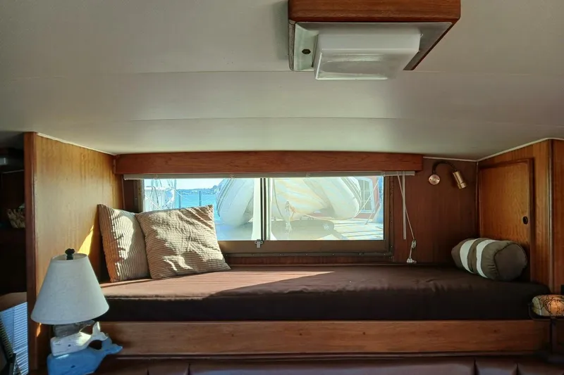 Slide: The Image of Cozy cabin interior of 1977 Hatteras 48 Long Range Cruiser with window view. - 19