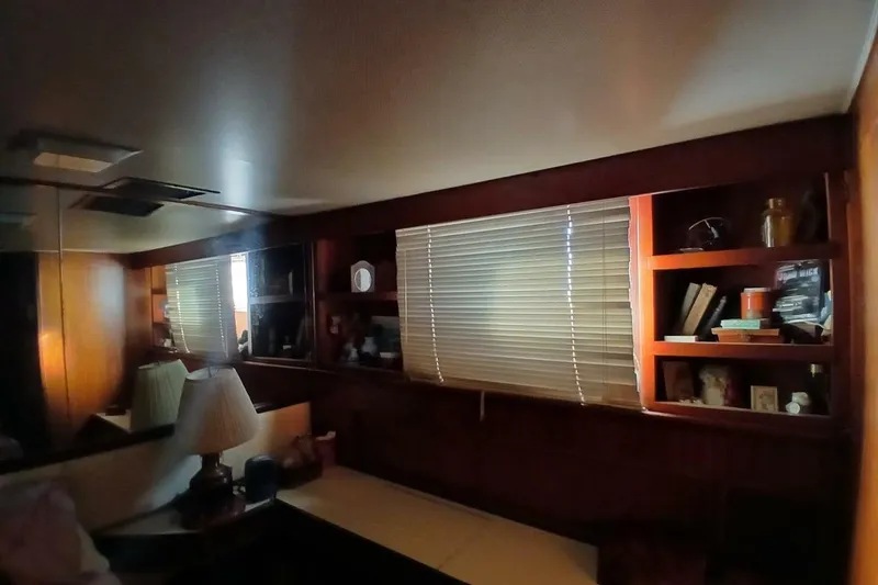 Slide: The Image of Interior of 1977 Hatteras 48 Long Range Cruiser with wooden shelves and blinds. - 32