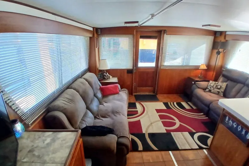 Slide: The Image of Interior of 1977 Hatteras 48 Long Range Cruiser with cozy seating and modern decor. - 4