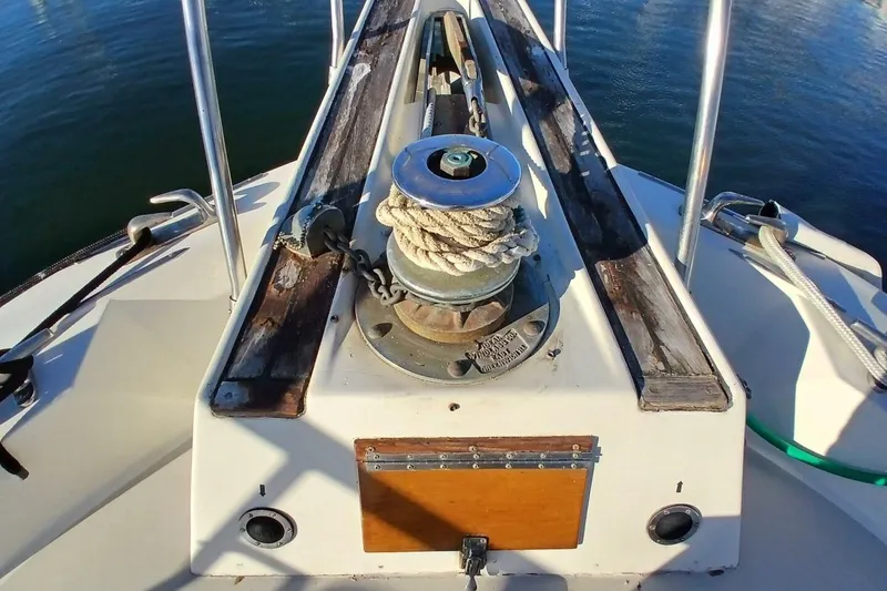 Slide: The Image of 1977 Hatteras 48 Long Range Cruiser bow with winch and ropes. - 51