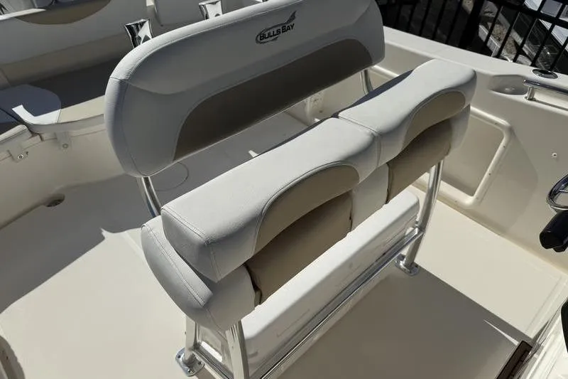 Slide: The Image of 2025 Bulls Bay 230 Center Console boat seating, featuring cushioned dual seats and sleek design. - 12
