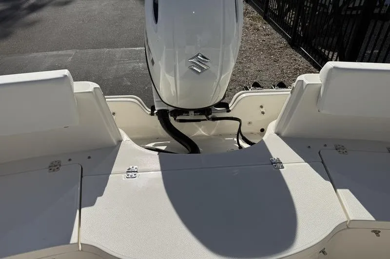 Slide: The Image of 2025 Bulls Bay 230 Center Console boat with Suzuki outboard motor, rear deck view. - 20