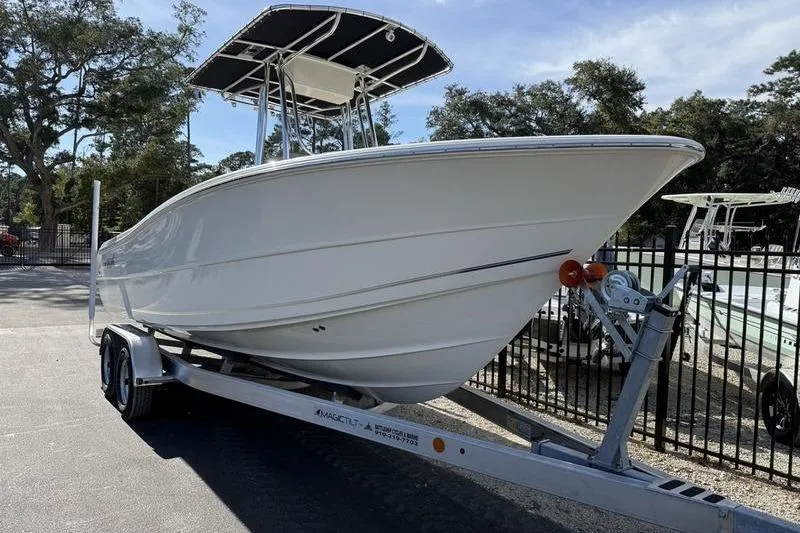 Slide: The Image of 2025 Bulls Bay 230 Center Console boat on trailer, parked outdoors. - 3