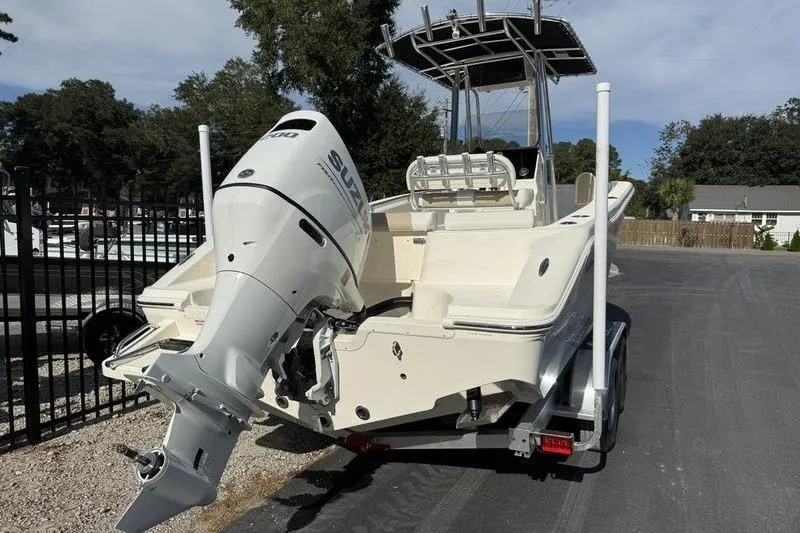 Slide: The Image of 2025 Bulls Bay 230 Center Console boat with Suzuki outboard motor on trailer. - 4
