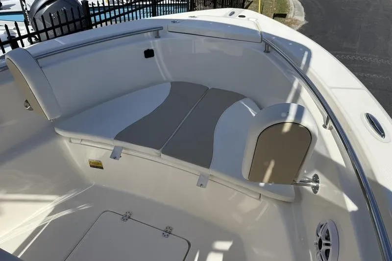 Slide: The Image of 2025 Bulls Bay 230 Center Console boat interior with cushioned seating and storage. - 6