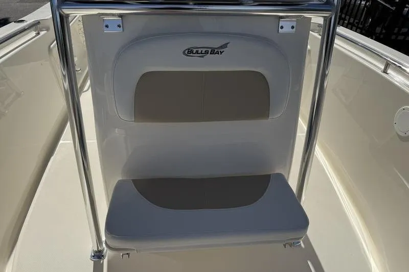 Slide: The Image of 2025 Bulls Bay 230 Center Console boat seat with logo and stainless steel frame. - 8