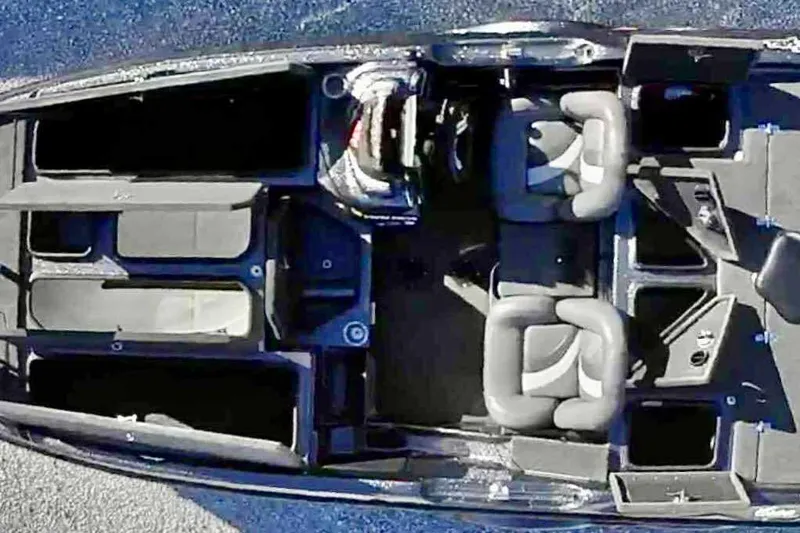 Slide: The Image of Overhead view of 2014 Bass Cat Eyra boat interior with seating and storage compartments. - 9