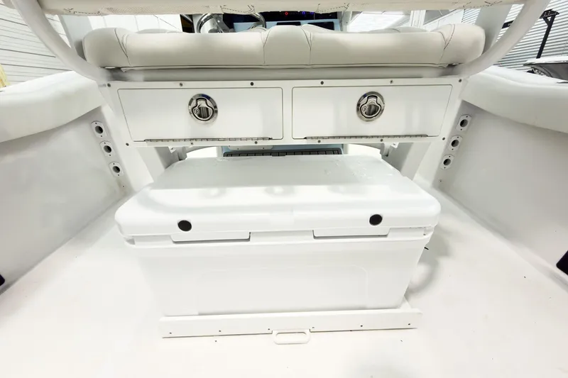 Slide: The Image of 2026 Tidewater 232 LXF boat interior with storage compartments and seating. - 17