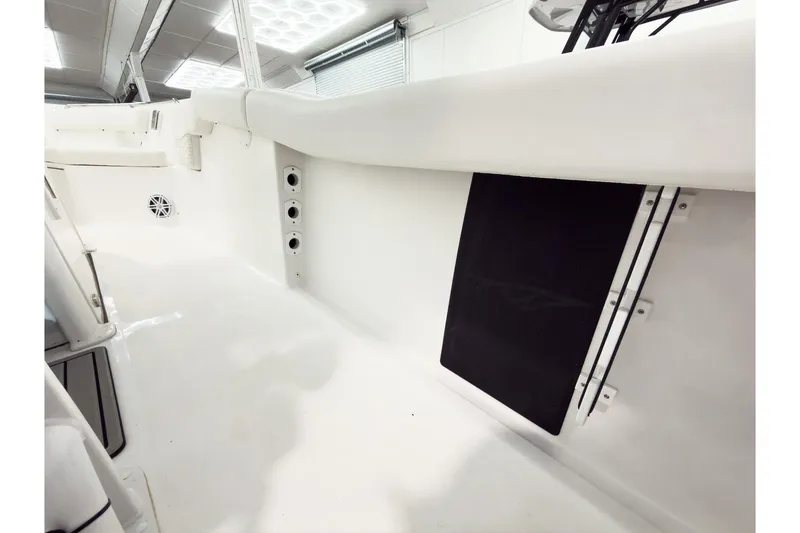 Slide: The Image of 2026 Tidewater 232 LXF boat interior, featuring sleek white design and modern fixtures. - 25