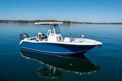 Slide: The Image of 2026 Tidewater 232 LXF boat with Yamaha 300 V6 engine in a workshop setting. - 3