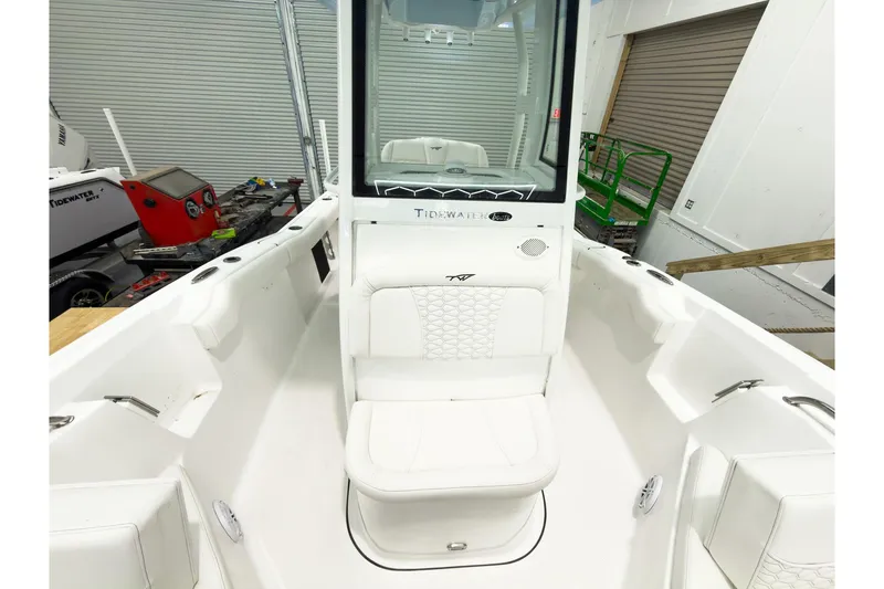 Slide: The Image of 2026 Tidewater 232 LXF boat interior with white seating and modern design. - 39