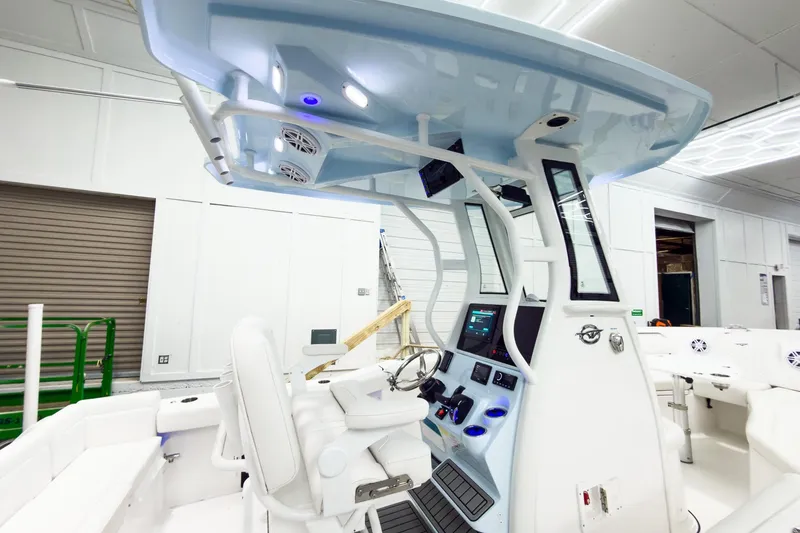 Slide: The Image of 2026 Tidewater 232 LXF boat interior with modern helm and seating. - 8