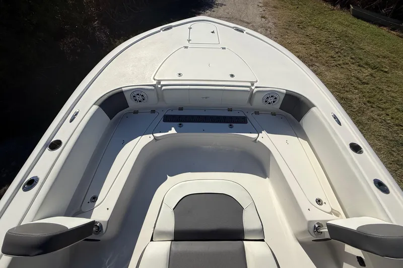 Slide: The Image of 2021 Tidewater 2700 Carolina Bay boat interior with seating and storage compartments. - 19