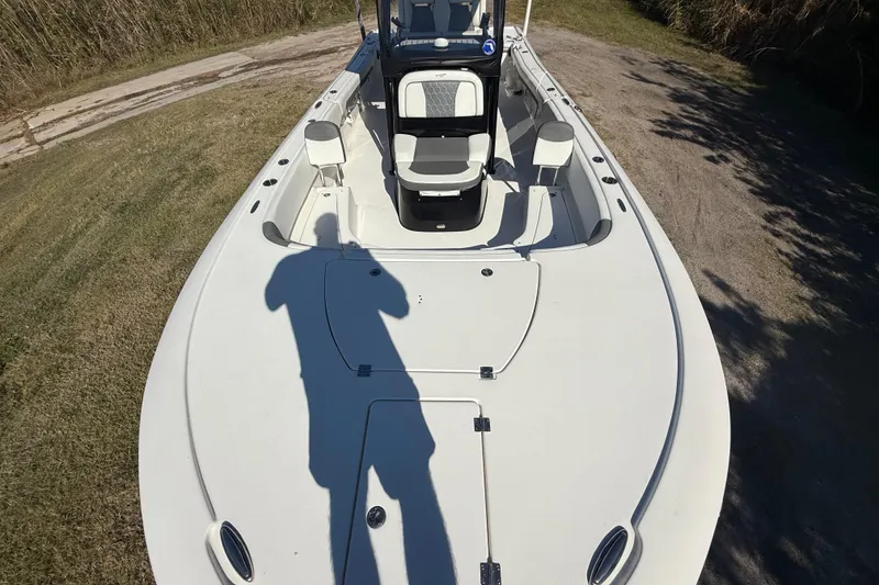 Slide: The Image of 2021 Tidewater 2700 Carolina Bay boat deck with seating and storage compartments. - 20