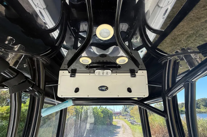 Slide: The Image of Interior view of 2021 Tidewater 2700 Carolina Bay boat with sleek black framework. - 39