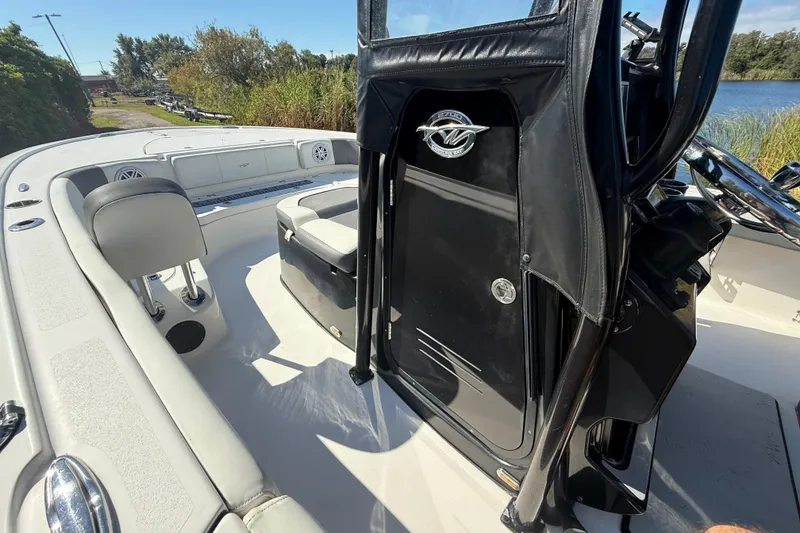 Slide: The Image of 2021 Tidewater 2700 Carolina Bay boat interior with seating and console details. - 41