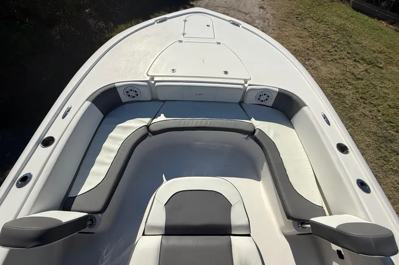 Slide: The Image of 2021 Tidewater 2700 Carolina Bay boat interior with cushioned seating and storage compartments. - 43