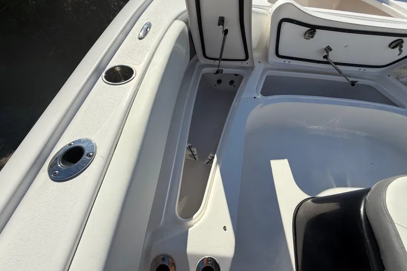 Slide: The Image of 2021 Tidewater 2700 Carolina Bay boat interior with open storage compartments. - 46