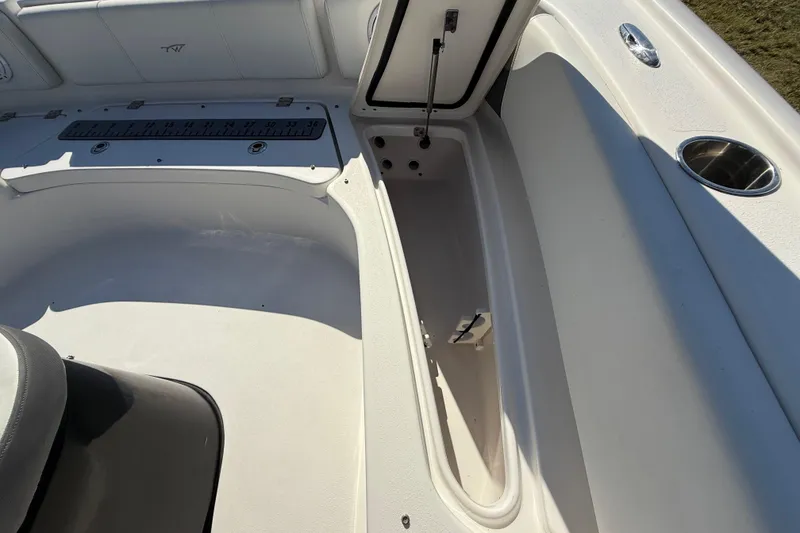 Slide: The Image of 2021 Tidewater 2700 Carolina Bay boat interior with open storage compartment. - 48