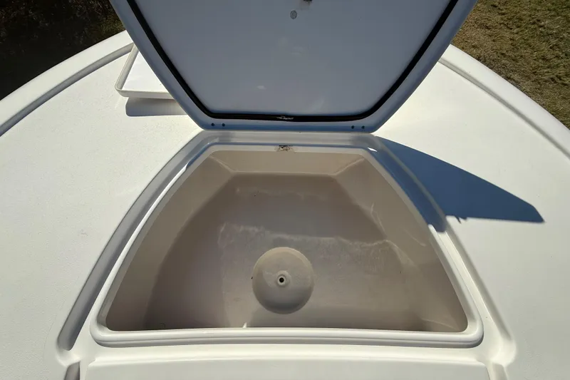 Slide: The Image of Open storage compartment on 2021 Tidewater 2700 Carolina Bay boat. - 49