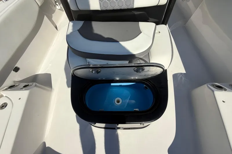 Slide: The Image of 2021 Tidewater 2700 Carolina Bay boat interior with open storage compartment. - 52