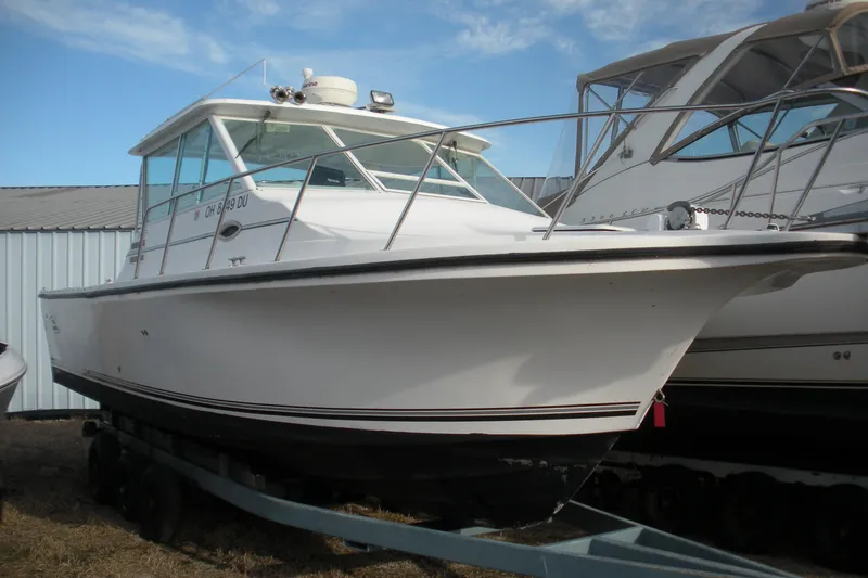 The Image of 2005 Baha Cruisers 299 SF boat on trailer, side view. - 0