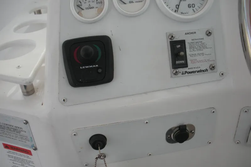Slide: The Image of Control panel of 2005 Baha Cruisers 299 SF boat with gauges and switches. - 12
