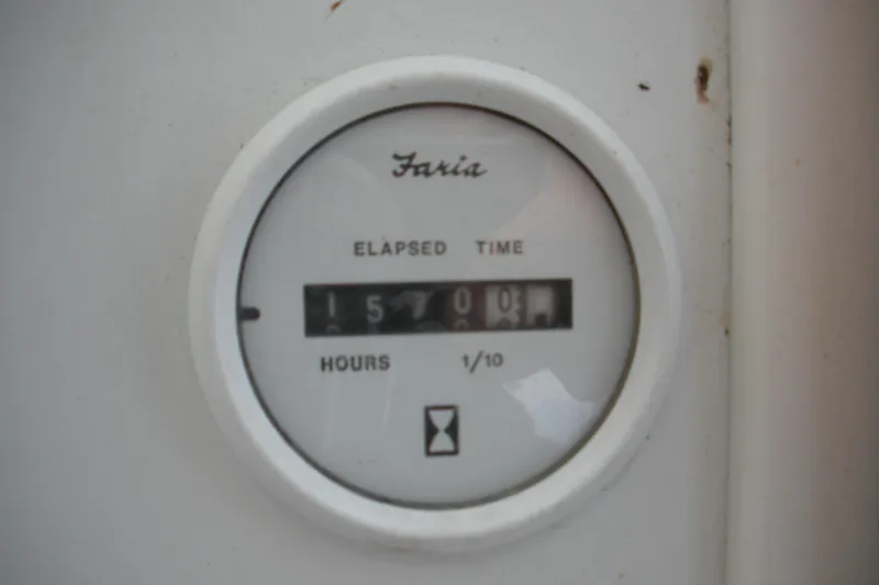 Slide: The Image of Hour meter on 2005 Baha Cruisers 299 SF showing 1570.0 hours elapsed. - 14
