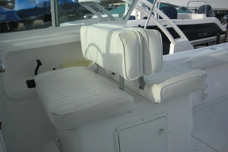 Slide: The Image of 2005 Baha Cruisers 299 SF boat interior with white cushioned seating. - 16