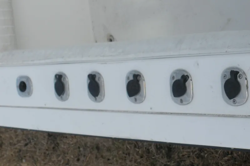 Slide: The Image of 2005 Baha Cruisers 299 SF boat electrical panel with multiple outlets. - 19