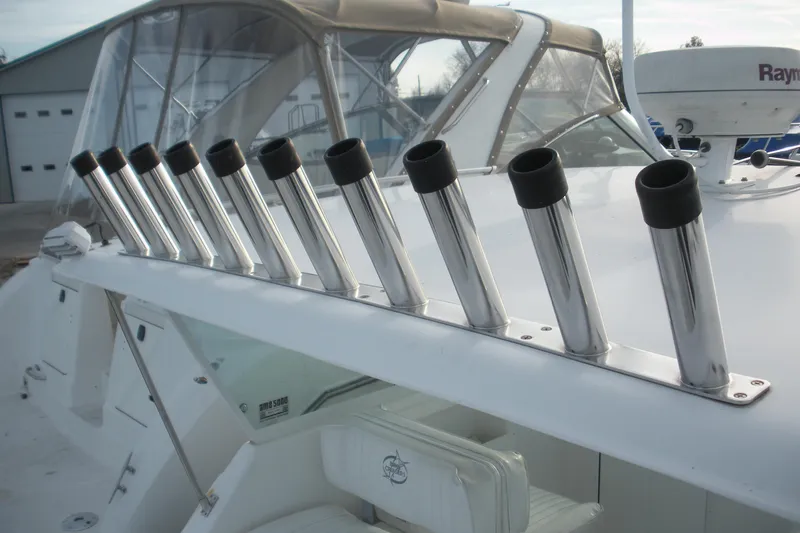 Slide: The Image of 2005 Baha Cruisers 299 SF boat with multiple stainless steel rod holders. - 3