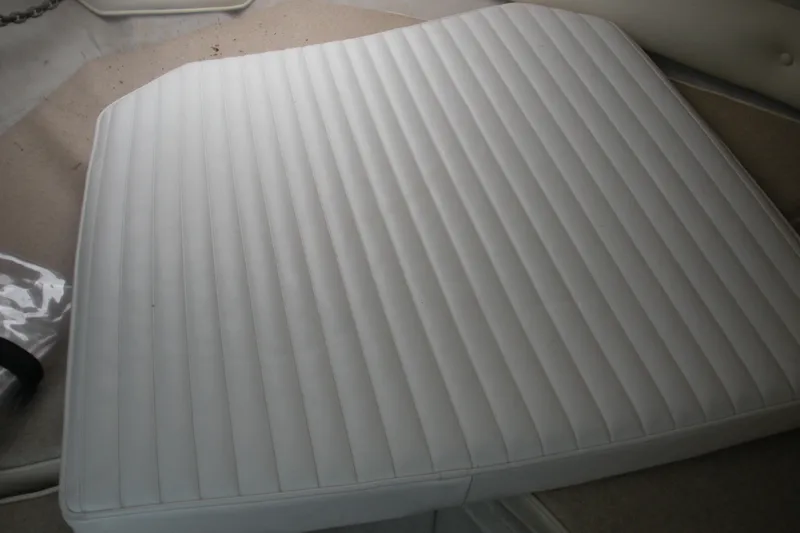 Slide: The Image of White cushioned seat on 2005 Baha Cruisers 299 SF boat interior. - 7