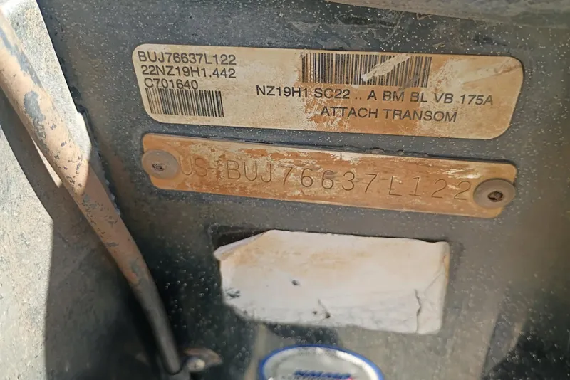 Slide: The Image of 2022 Tracker boat identification plate with serial number and barcode details. - 14