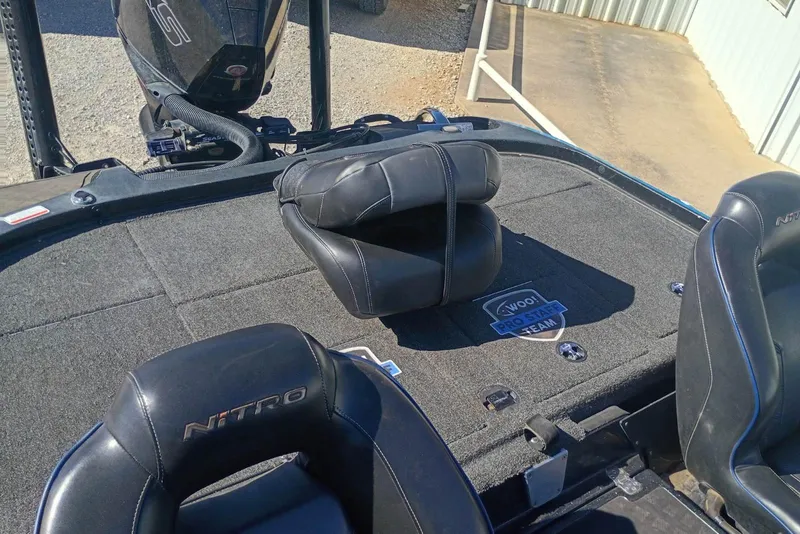 Slide: The Image of 2022 Tracker boat interior with Nitro seats and Woo! Pro Staff Team badge. - 3