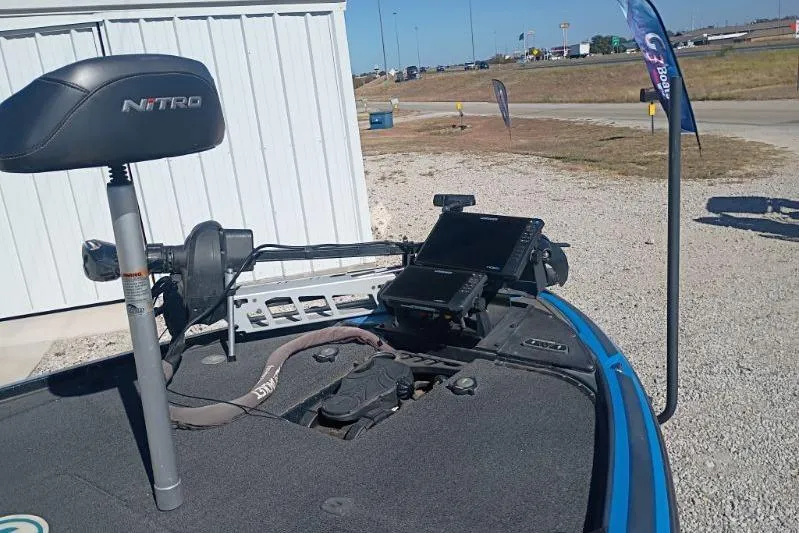 Slide: The Image of 2022 Tracker boat with Nitro seat and electronic equipment on deck. - 9