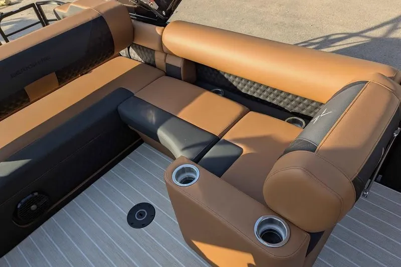 Slide: The Image of Luxurious seating on 2026 Berkshire 25SB2 STS 3.0 boat with cup holders and stylish upholstery. - 10