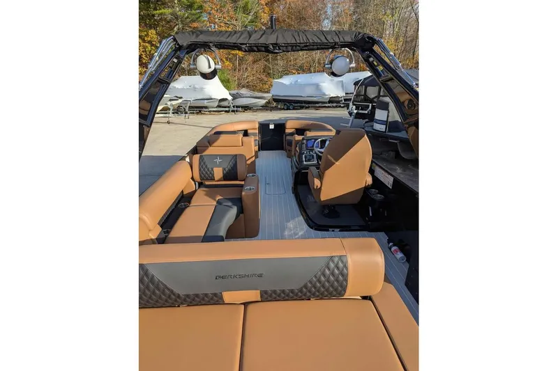 Slide: The Image of 2026 Berkshire 25SB2 STS 3.0 pontoon boat interior with tan and black seating. - 13