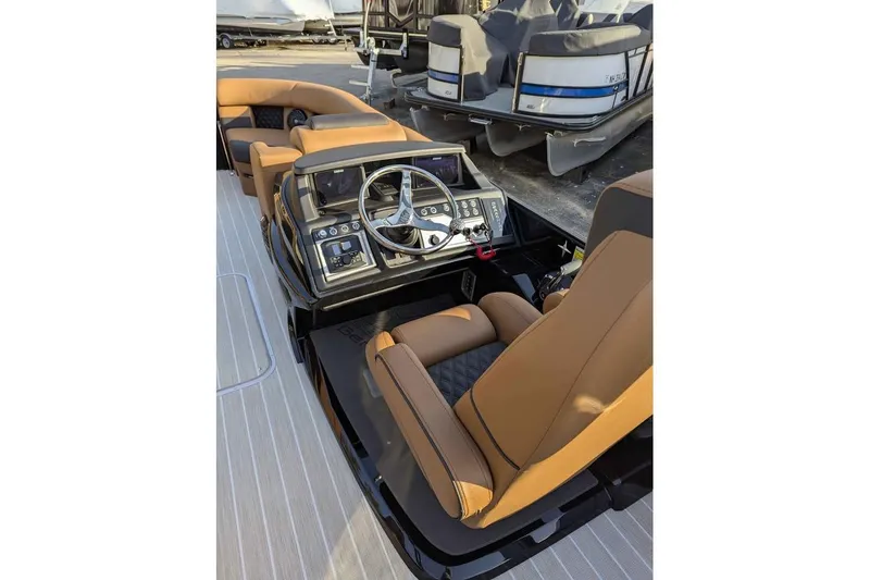 Slide: The Image of Luxurious interior of 2026 Berkshire 25SB2 STS 3.0 pontoon boat with modern helm and seating. - 14