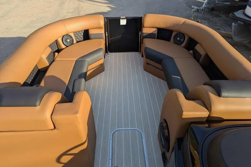 Slide: The Image of 2026 Berkshire 25SB2 STS 3.0 pontoon boat interior with tan and black seating. - 17