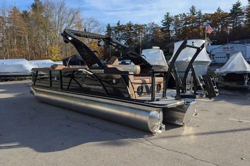 Slide: The Image of 2026 Berkshire 25SB2 STS 3.0 pontoon boat in a marina setting. - 2