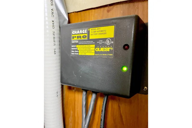 Slide: The Image of Battery charger installed on 1981 Beneteau First 32 sailboat, with green indicator light. - 13