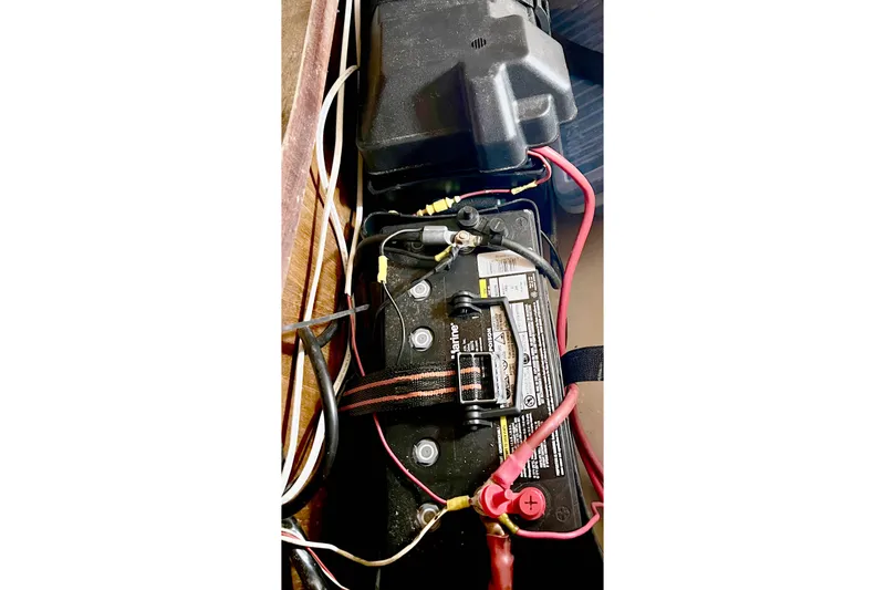 Slide: The Image of Battery setup in a 1981 Beneteau First 32 sailboat with connected wiring. - 15