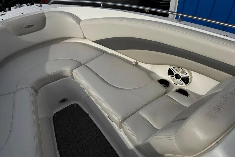 Slide: The Image of 2008 Chaparral 256 SSi boat interior with white leather seating and speaker system. - 17