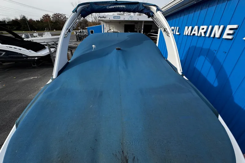 Slide: The Image of 2008 Chaparral 256 SSi boat covered, parked at a marine dealership. - 20