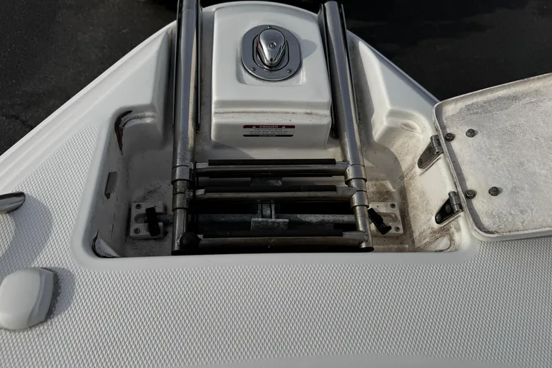 Slide: The Image of 2008 Chaparral 256 SSi boat ladder compartment with stainless steel fittings. - 22