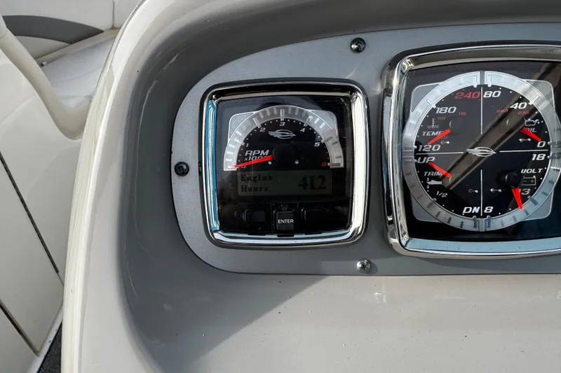 Slide: The Image of Dashboard of 2008 Chaparral 256 SSi boat showing RPM and engine hours. - 27